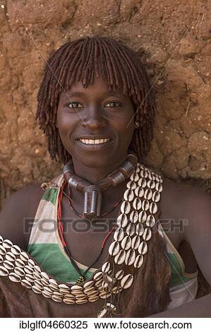 Stock Photography - Woman, smiling, portrait, Hamer tribe, Turmi market, Southern Nations Nationalities and Peoples' Region, Ethiopia, Africa. Fotosearch
