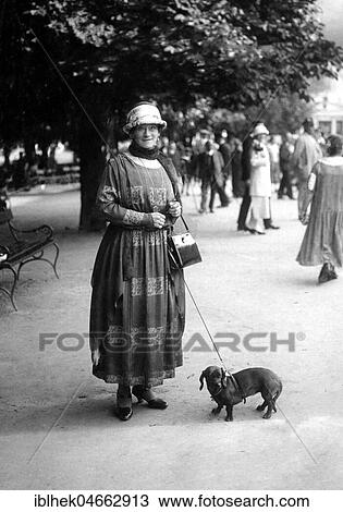 Woman walking her dachshund, 1920s, Germany, Europe View Large Photo Image Stock Image - Woman walking her dachshund, 1920s, Germany, Europe. Fotosearch