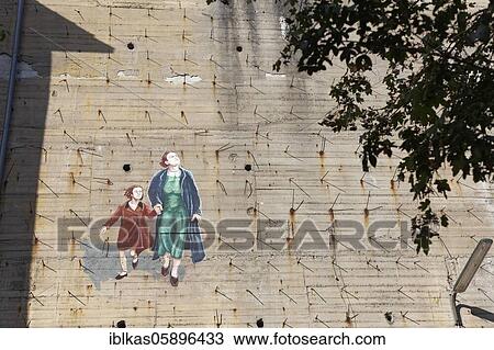 Woman with child fleeing from a bomb alarm, mural at a bunker from World War II, Düsseldorf-Rath, North Rhine-Westphalia, Germany, Europe View Large Photo Image Stock Image - Woman with child fleeing from a bomb alarm, mural at a bunker from World War II, Düsseldorf-Rath, North Rhine-Westphalia, Germany, Europe. Fotosearch