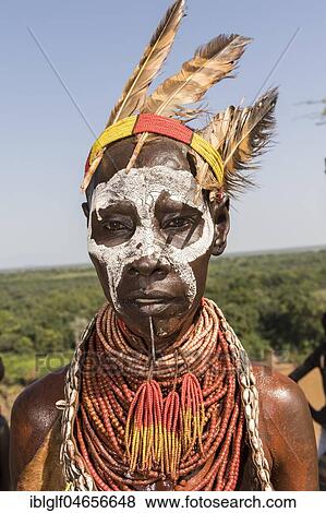 Stock Photo - Woman with face painting and feather decoration, Karo tribe, Southern Nations Nationalities and Peoples' Region, Ethiopia, Africa. Fotosearch