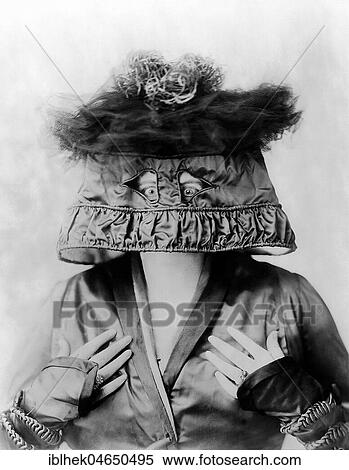 Stock Photography - Woman with lampshade on her head, hat fashion, fashion satire, 1920s, Germany, Europe. Fotosearch
