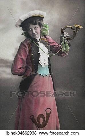 Stock Photo - Woman with post horn, 1910s, handcoloured, Germany, Europe. Fotosearch