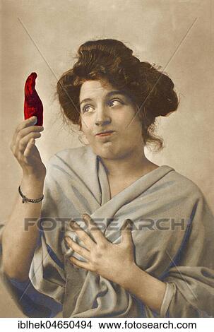 Picture - Woman with sweet pepper, 1910s, Germany, Europe. Fotosearch
