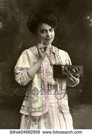 Woman with two-eyed camera, 1900s, hand-coloured, Germany, Europe View Large Photo Image Stock Photo - Woman with two-eyed camera, 1900s, hand-coloured, Germany, Europe. Fotosearch
