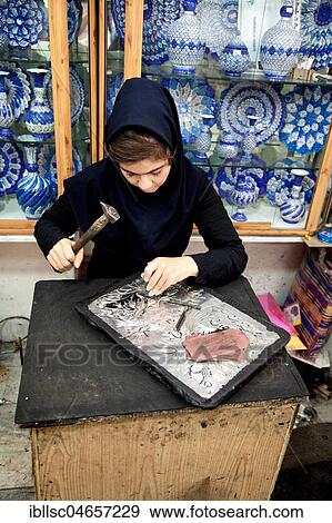 Woman working on copper, handicraft, Isfahan, Iran, Asia View Large Photo Image Stock Photo - Woman working on copper, handicraft, Isfahan, Iran, Asia. Fotosearch