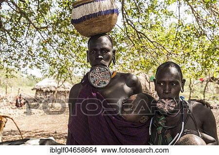 Picture - Women with lip plates, tribe of the Mursi, Southern Nations Nationalities and Peoples' Region, Ethiopia, Africa. Fotosearch