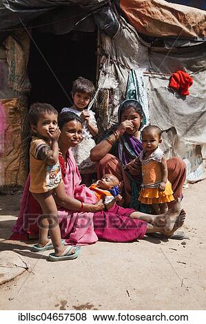 Women with small children in the slum at the Ghazipur garbage dump, New Delhi, India, Asia View Large Photo Image Stock Photo - Women with small children in the slum at the Ghazipur garbage dump, New Delhi, India, Asia. Fotosearch
