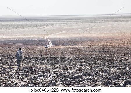 Worker in the salt desert at the edge of the Danakil Valley, Ethiopia, Africa View Large Photo Image Stock Image - Worker in the salt desert at the edge of the Danakil Valley, Ethiopia, Africa. Fotosearch