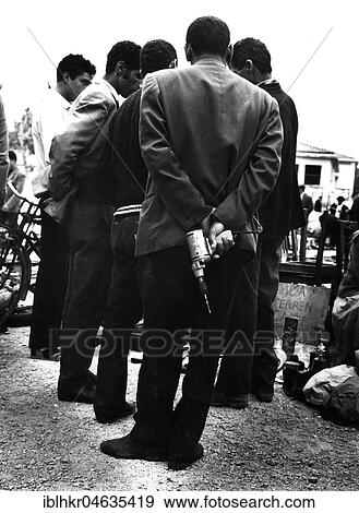 Stock Photo - Workers discuss a problem, between 50s and 60s, exact location unknown, France, Europe. Fotosearch