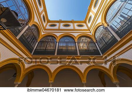 Stock Image - Yellow Courtyard, Alcazar, Royal Palace of Seville, Seville, Spain, Europe. Fotosearch
