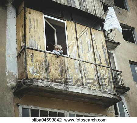 Young boy looks out of the window of an almost deserted house, former mining town Akarmara, nine families still live in the ghost town, Akarmara, Abkhazia, Georgia, Asia View Large Photo Image Stock Image - Young boy looks out of the window of an almost deserted house, former mining town Akarmara, nine families still live in the ghost town, Akarmara, Abkhazia, Georgia, Asia. Fotosearch