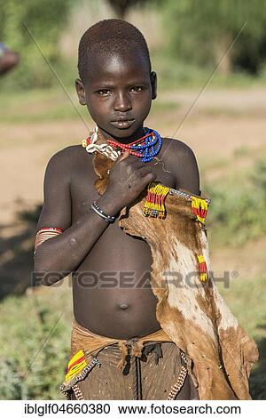 Stock Image - Young girl, Hamer tribe, Turmi market, Southern Nations Nationalities and Peoples' Region, Ethiopia, Africa. Fotosearch