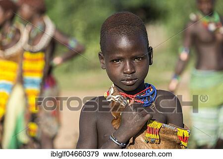 Stock Photo - Young girl, portrait, Hamer tribe, Turmi market, Southern Nations Nationalities and Peoples' Region, Ethiopia, Africa. Fotosearch