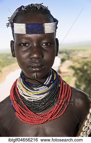 Young girl, portrait, Karo tribe, Omo River, Southern Nations Nationalities and Peoples' Region, Ethiopia, Africa View Large Photo Image Stock Photograph - Young girl, portrait, Karo tribe, Omo River, Southern Nations Nationalities and Peoples' Region, Ethiopia, Africa. Fotosearch
