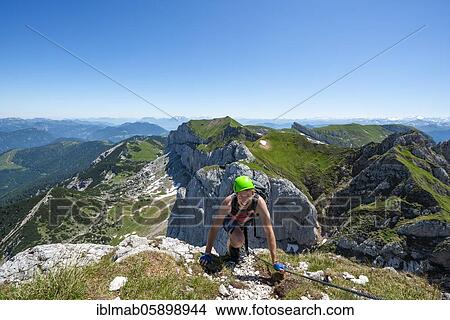 Young man climbing, via ferrata to the Seekarlspitze, 5-summit via ferrata, hike at the Rofangebirge, Tyrol, Austria, Europe View Large Photo Image Picture - Young man climbing, via ferrata to the Seekarlspitze, 5-summit via ferrata, hike at the Rofangebirge, Tyrol, Austria, Europe. Fotosearch