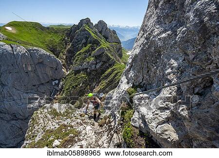 Stock Photography - Young man climbing, via ferrata to the Seekarlspitze, 5-summit via ferrata, hike at the Rofangebirge, Tyrol, Austria, Europe. Fotosearch