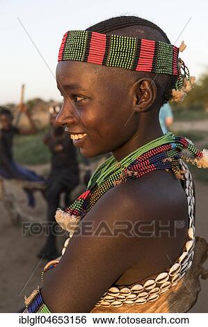 Young married woman with head and necklace, Hamer tribe, portrait, Turmi, region of southern nations, nationalities and peoples, Ethiopia, Africa View Large Photo Image Stock Photograph - Young married woman with head and necklace, Hamer tribe, portrait, Turmi, region of southern nations, nationalities and peoples, Ethiopia, Africa. Fotosearch
