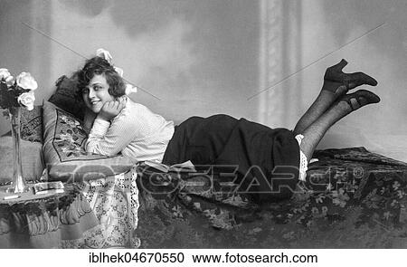 Young pretty woman posing on the sofa, 1920s, Germany, Europe View Large Photo Image Stock Image - Young pretty woman posing on the sofa, 1920s, Germany, Europe. Fotosearch