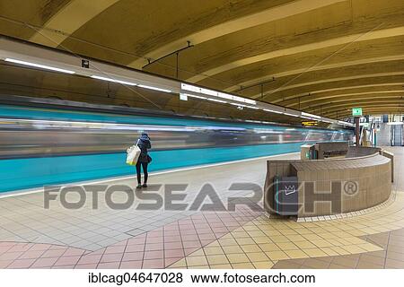 Young woman alone at the platform, subway station Opernplatz, Frankfurt am Main, Hesse, Germany, Europe View Large Photo Image Stock Photo - Young woman alone at the platform, subway station Opernplatz, Frankfurt am Main, Hesse, Germany, Europe. Fotosearch