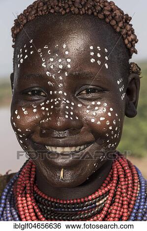 Young woman with face painting, portrait, laughing, Karo tribe, Southern Nations Nationalities and Peoples' Region, Ethiopia, Africa View Large Photo Image Stock Photograph - Young woman with face painting, portrait, laughing, Karo tribe, Southern Nations Nationalities and Peoples' Region, Ethiopia, Africa. Fotosearch