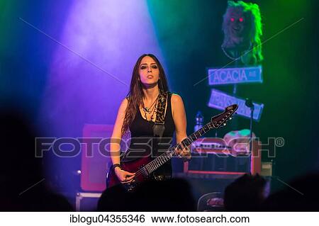 The American women's metal band The Iron Maidens, tribute band of the British heavy metal band Iron Maiden live in the Schüür Lucerne, Switzerland vocals Kirsten Rosenberg drumset Linda McDonald guitar Courtney Cox guitar Nita Strauss View Large Photo Image Stock Photograph - The American women's metal band The Iron Maidens, tribute band of the British heavy metal band Iron Maiden live in the Schüür Lucerne, Switzerland vocals Kirsten Rosenberg drumset Linda McDonald guitar Courtney Cox guitar Nita Strauss. Fotosearch