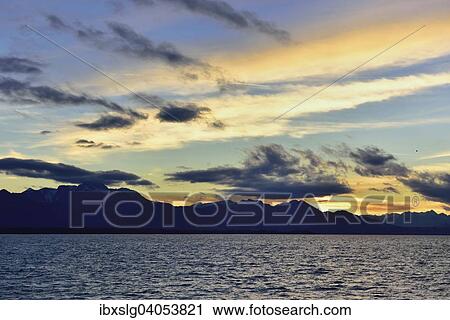 Abendrot am Chiemsee, Silhouette Chiemgauer Alpen, bei Chieming, Voralpenland, Chiemgau, Bayern, Deutschland, Europa View Large Photo Image Stock Image - Abendrot am Chiemsee, Silhouette Chiemgauer Alpen, bei Chieming, Voralpenland, Chiemgau, Bayern, Deutschland, Europa. Fotosearch