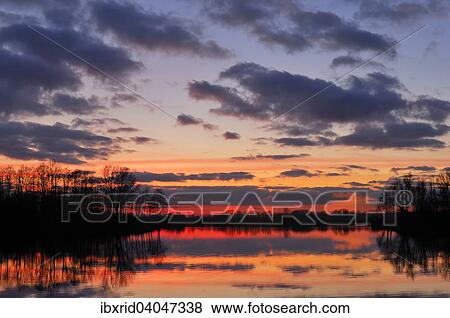 Abendrot am See mit Baumen und Wolken, Alpen-Menzelen, Nordrhein-Westfalen, Deutschland, Europa View Large Photo Image Stock Photo - Abendrot am See mit Baumen und Wolken, Alpen-Menzelen, Nordrhein-Westfalen, Deutschland, Europa. Fotosearch