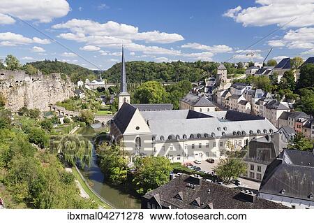 Abtei Neumunster in der Unterstadt Grund, hinten ehemalige Festungsmauer, UNESCO Weltkulturerbe, Luxemburg Stadt, Grossherzogtum Luxemburg View Large Photo Image Stock Photo - Abtei Neumunster in der Unterstadt Grund, hinten ehemalige Festungsmauer, UNESCO Weltkulturerbe, Luxemburg Stadt, Grossherzogtum Luxemburg. Fotosearch