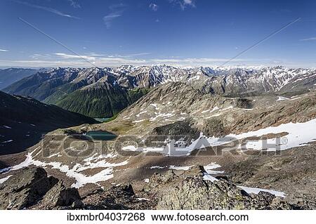 Stock Photo - Ausblick auf den Finailsee, beim Aufstieg auf die Grawand durch das Finailtal in Schnals, hinten das Ortlergebiet mit Konig, Zebru und Ortler, unten das Schnalstal mit dem Vernagter Stausee, Meraner Land, Meran und Umgebung, Sudtirol, Italien, Europa. Fotosearch