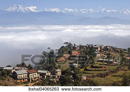 Ausblick auf Landschaft, landliche Hauser, Terrassenfelder und Berge des Himalaya, Nebel liegt im Tal, bei Dhulikel, Nepal, Asien View Large Photo Image Stock Image - Ausblick auf Landschaft, landliche Hauser, Terrassenfelder und Berge des Himalaya, Nebel liegt im Tal, bei Dhulikel, Nepal, Asien. Fotosearch