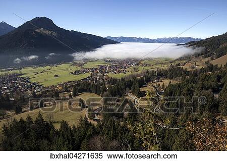 Ausblick in das Ostrachtal, links Bad Oberdorf, Mitte Imberger Horn, rechts Bad Hindelang mit Nebel, Allgau, Bayern, Deutschland, Europa View Large Photo Image Stock Photography - Ausblick in das Ostrachtal, links Bad Oberdorf, Mitte Imberger Horn, rechts Bad Hindelang mit Nebel, Allgau, Bayern, Deutschland, Europa. Fotosearch