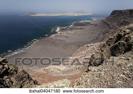 Ausblick vom Famara Kliff, Risco de Famara, auf Playa del Risco und Isla Graciosa, Lanzarote, Kanarische Inseln, Spanien, Europa View Large Photo Image Stock Image - Ausblick vom Famara Kliff, Risco de Famara, auf Playa del Risco und Isla Graciosa, Lanzarote, Kanarische Inseln, Spanien, Europa. Fotosearch