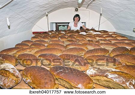 Stock Photo - Bauerin backt Brot in der eigenen Backstube am Bauernhof, im sogenannten Brothimmel, Tirol, Osterreich, Europa. Fotosearch