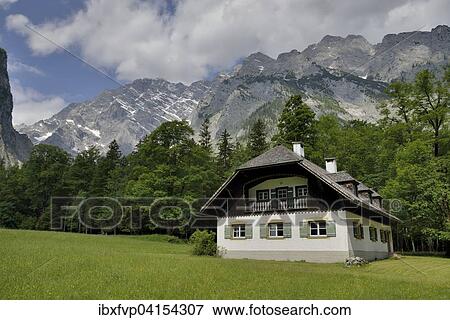 Stock Photo - Bauernhaus vor der Ostwand des Watzmann, St. Bartholoma, Oberbayern, Bayern, Deutschland, Europa. Fotosearch
