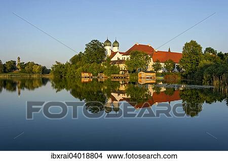 Benediktinerabtei Kloster Seeon mit Klosterkirche St. Lambert, Klostersee, hinten Nebenkirche Maria zu Breuhausen, auch Brauhausen, Seeon-Seebruck, Chiemgau, Oberbayern, Bayern, Deutschland, Europa View Large Photo Image Picture - Benediktinerabtei Kloster Seeon mit Klosterkirche St. Lambert, Klostersee, hinten Nebenkirche Maria zu Breuhausen, auch Brauhausen, Seeon-Seebruck, Chiemgau, Oberbayern, Bayern, Deutschland, Europa. Fotosearch