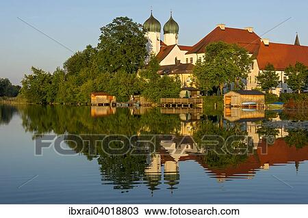 Benediktinerabtei Kloster Seeon mit Klosterkirche St. Lambert, Klostersee, Seeon-Seebruck, Chiemgau, Oberbayern, Bayern, Deutschland, Europa View Large Photo Image Stock Image - Benediktinerabtei Kloster Seeon mit Klosterkirche St. Lambert, Klostersee, Seeon-Seebruck, Chiemgau, Oberbayern, Bayern, Deutschland, Europa. Fotosearch