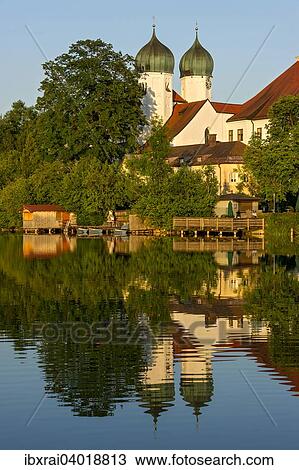 Benediktinerabtei Kloster Seeon mit Klosterkirche St. Lambert, Klostersee, Seeon-Seebruck, Chiemgau, Oberbayern, Bayern, Deutschland, Europa View Large Photo Image Stock Image - Benediktinerabtei Kloster Seeon mit Klosterkirche St. Lambert, Klostersee, Seeon-Seebruck, Chiemgau, Oberbayern, Bayern, Deutschland, Europa. Fotosearch
