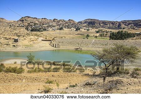 Berglandschaft mit einem kleinen Teich an der Strasse von Asmarra nach Qohaito, Eritrea, Afrika View Large Photo Image Stock Photograph - Berglandschaft mit einem kleinen Teich an der Strasse von Asmarra nach Qohaito, Eritrea, Afrika. Fotosearch