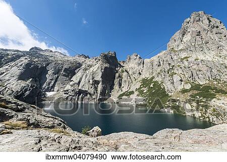 Stock Image - Bergsee Lac de Melo umgeben von Steilwanden, Quelle von dem Restonica Fluss, Restonica Hochtal, Corte, Departement Haute-Corse, Korsika, Frankreich, Europa. Fotosearch