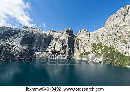 Stock Image - Bergsee Lac de Melo umgeben von Steilwanden, Quelle von dem Restonica Fluss, Restonica Hochtal, Corte, Departement Haute-Corse, Korsika, Frankreich, Europa. Fotosearch