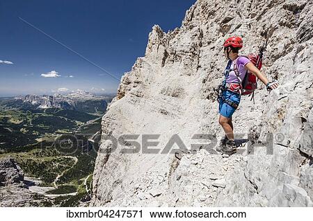 Stock Image - Bergsteiger beim Abstieg von der Sudliche Fanesspitze uber Klettersteig Via ferrata Veronesi, hinten der Sellastock, Dolomiten, Sudtirol, Alpen, Italien, Europa. Fotosearch
