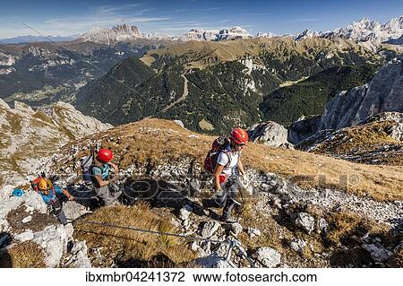 Bergsteiger beim Aufstieg auf die Cima Valacia uber den Kletterstieg Via Ferrata F. Gadotti im Val San Nicolo im Fassatal, hinten Langjofel und Plattkofel und die Sellagruppe, Pozza di Fassa, Dolomiten, Trentino, Trentino-Sudtirol, Italien, Europa View Large Photo Image Stock Image - Bergsteiger beim Aufstieg auf die Cima Valacia uber den Kletterstieg Via Ferrata F. Gadotti im Val San Nicolo im Fassatal, hinten Langjofel und Plattkofel und die Sellagruppe, Pozza di Fassa, Dolomiten, Trentino, Trentino-Sudtirol, Italien, Europa. Fotosearch