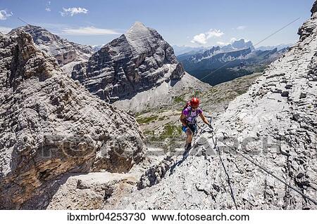 Bergsteiger, Klettersteig Via ferrata Tomaselli, Sudliche Fanesspitze, hinten die Tofana di Rozes, Tofana di Mezzo und der Pelmo, Dolomiten, Belluno, Alpen, Italien, Europa View Large Photo Image Stock Image - Bergsteiger, Klettersteig Via ferrata Tomaselli, Sudliche Fanesspitze, hinten die Tofana di Rozes, Tofana di Mezzo und der Pelmo, Dolomiten, Belluno, Alpen, Italien, Europa. Fotosearch
