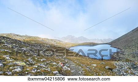 Stock Photograph - Bergsteiger, Lungauer Klaffersee, Rohrmoos-Untertal, Schladminger Tauern, Steiermark, Osterreich, Europa. Fotosearch