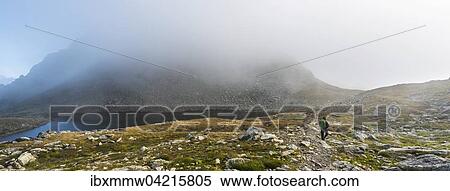 Stock Photography - Bergsteiger, Lungauer Klaffersee, Rohrmoos-Untertal, Schladminger Tauern, Steiermark, Alpen, Osterreich, Europa. Fotosearch