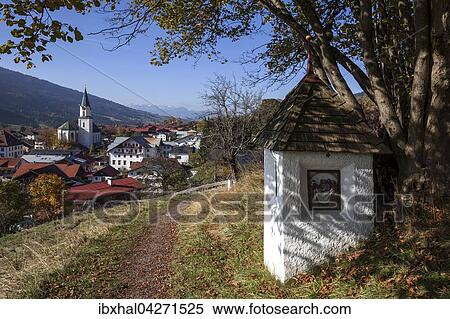 Stock Photography - Bildstock am Weg zur Kalvarienkapelle, Herbststimmung, hinten Bad Hindelang mit der Pfarrkirche St. Johannes Baptist, Allgau, Bayern, Deutschland, Europa. Fotosearch