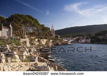 Blick auf die Hafeneinfahrt von Veli Losinj, mit Basilikus-Kirche, Insel Cres, Kvarner Bucht, Adria, Kroatien, Europa View Large Photo Image Stock Photo - Blick auf die Hafeneinfahrt von Veli Losinj, mit Basilikus-Kirche, Insel Cres, Kvarner Bucht, Adria, Kroatien, Europa. Fotosearch