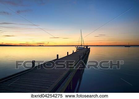 Bootsanleger mit Segelboot bei Abendrot, Steinhuder Meer, Steinhude, Niedersachsen, Deutschland, Europa View Large Photo Image Stock Photography - Bootsanleger mit Segelboot bei Abendrot, Steinhuder Meer, Steinhude, Niedersachsen, Deutschland, Europa. Fotosearch