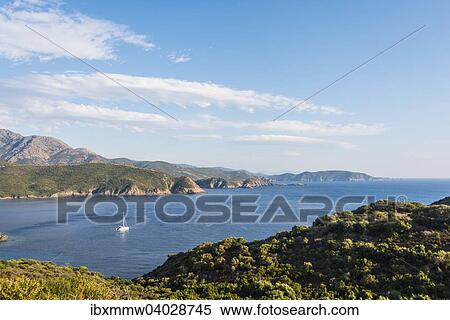 Bucht mit Segelboot, Kuste und Berglandschaft, Golf von Porto, Korsika, Frankreich, Europa View Large Photo Image Stock Photography - Bucht mit Segelboot, Kuste und Berglandschaft, Golf von Porto, Korsika, Frankreich, Europa. Fotosearch