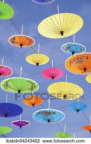 Bunte Sonnenschirme hangen in der Luft, Sonnenschirm-Festival in Bo Sang bei Chiang Mai, Thailand, Asien View Large Photo Image Stock Image - Bunte Sonnenschirme hangen in der Luft, Sonnenschirm-Festival in Bo Sang bei Chiang Mai, Thailand, Asien. Fotosearch